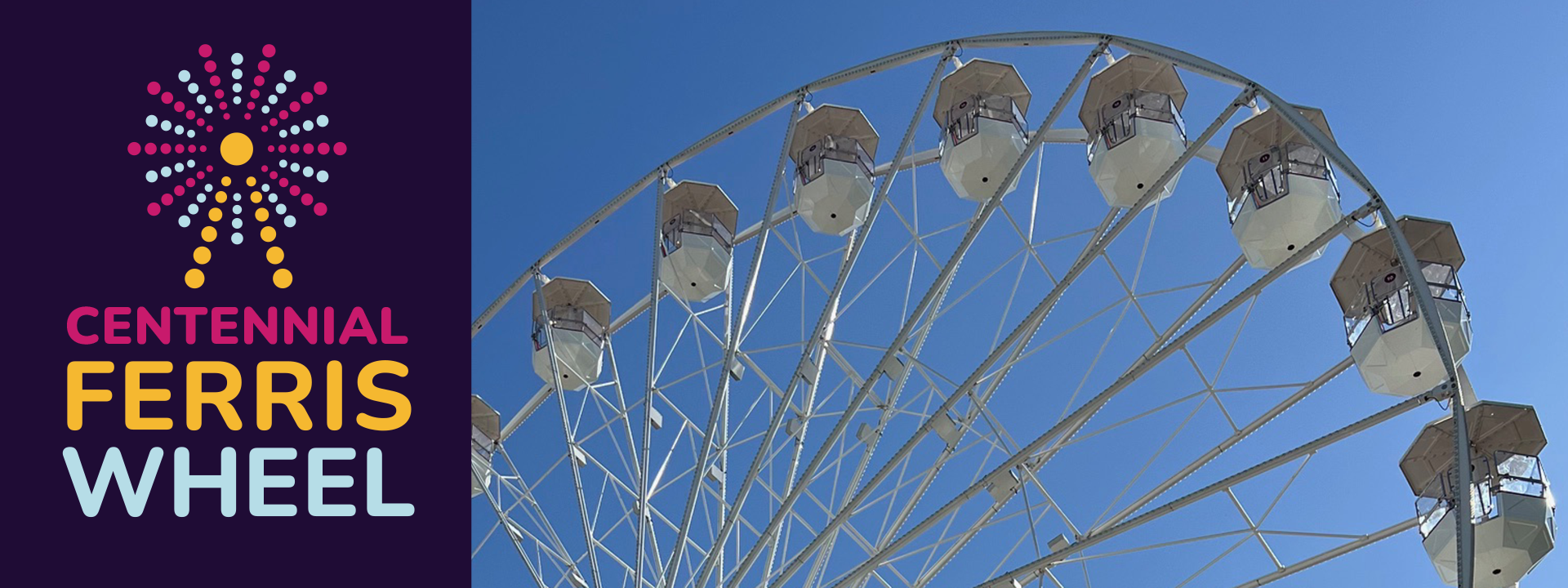 Ferris Wheel with blue sky behind it